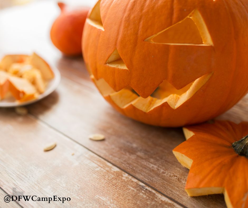 A recently carved pumpkin sits on a table.