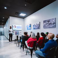 Families attending a spinal health education session at CTC Chiropractic in Frisco