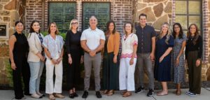 Counseling team standing together outside their office